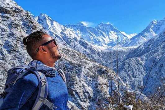 Trekking path leading to Everest Base Camp with stunning views of Mount Everest and surrounding peaks.