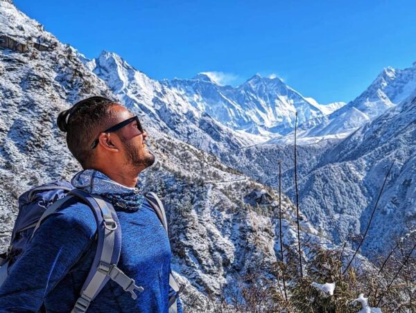 Trekking path leading to Everest Base Camp with stunning views of Mount Everest and surrounding peaks.